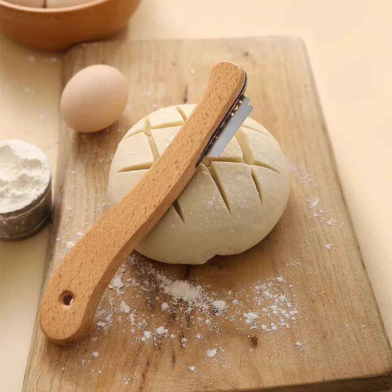 Classic wooden-handled bread scoring lame for professional sourdough baking